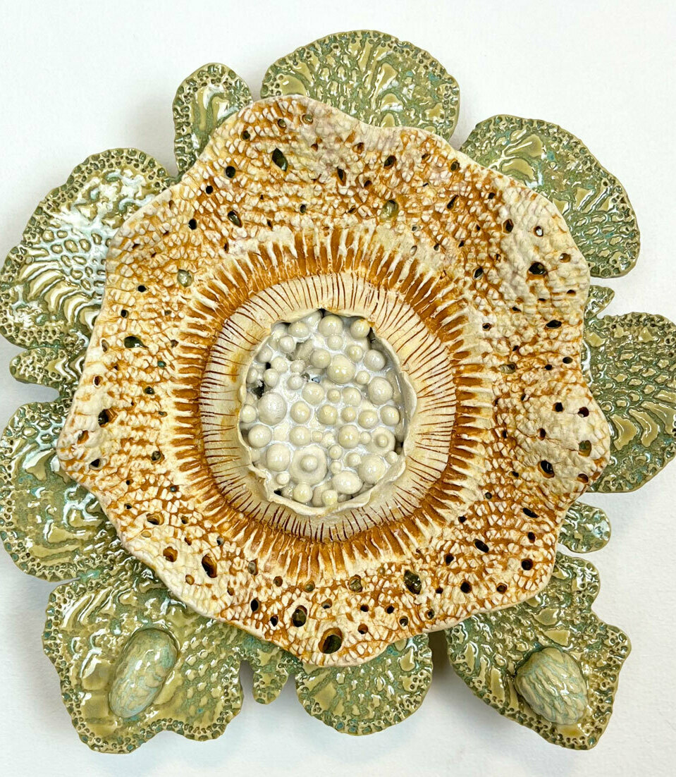 Detailed ceramic wall sculpture depicting the cellular structure of a Pine Needle as seen through a micrograph, with an emphasis on organic forms, intricate patterns and textures. 