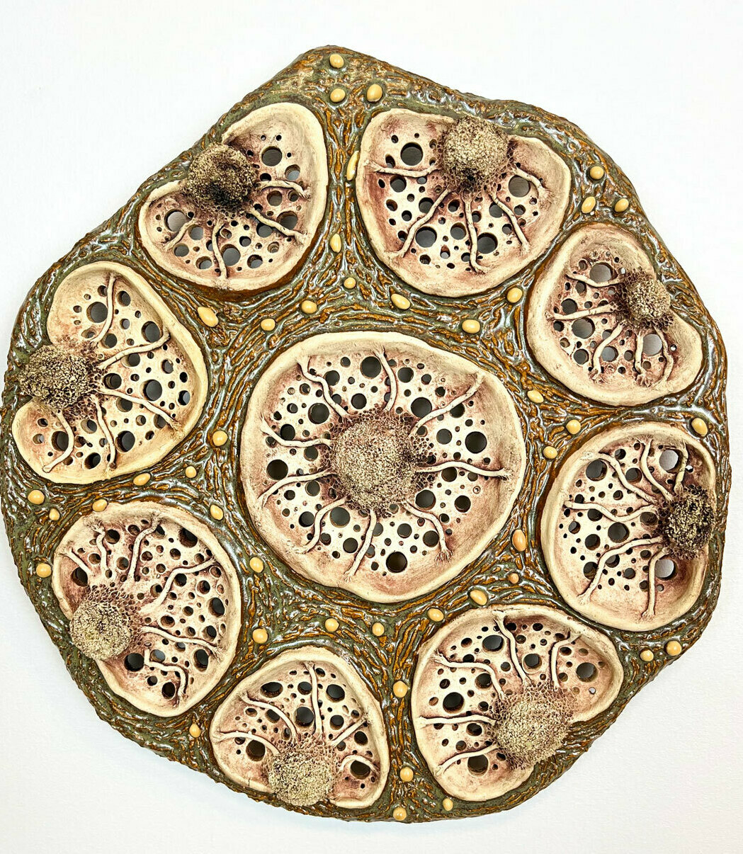 Detailed ceramic wall sculpture depicting the cellular structure of the stem of a Liana flower, as seen through a micrograph, with an emphasis on organic forms, intricate patterns and textures. 